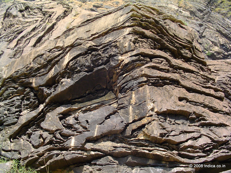 Rock formation at Jog Falls. Geologists call is the Dharwar system, curiously named after a place in Karnataka. These reddish to brown to black rocks are some of the oldest found in India. As you get closer , it is much larger than you've imagined. Some are as big as an elephant , some are even larger than a house.