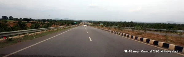 Take NH48 to Hassan, from where take the diversion for Belur and Halebid