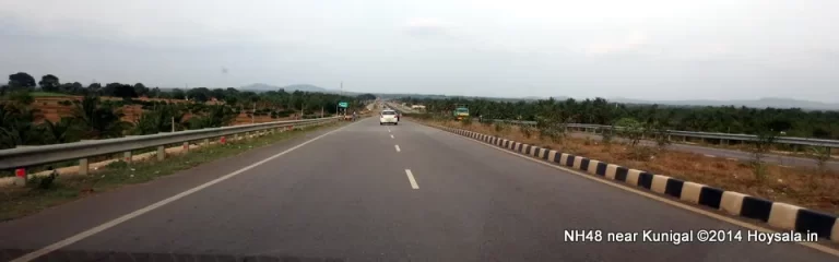 Take NH48 to Hassan, from where take the diversion for Belur and Halebid