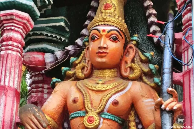 Brightly painted stucco image in the porch of the Temple.