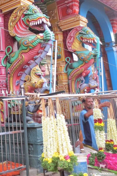 Garland kiosks in front of the Thiruparankundram Muruga Temple.