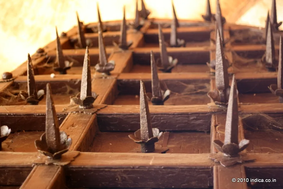 Spikes on the doors at the gateway. To prevent force open the doors using elephants!