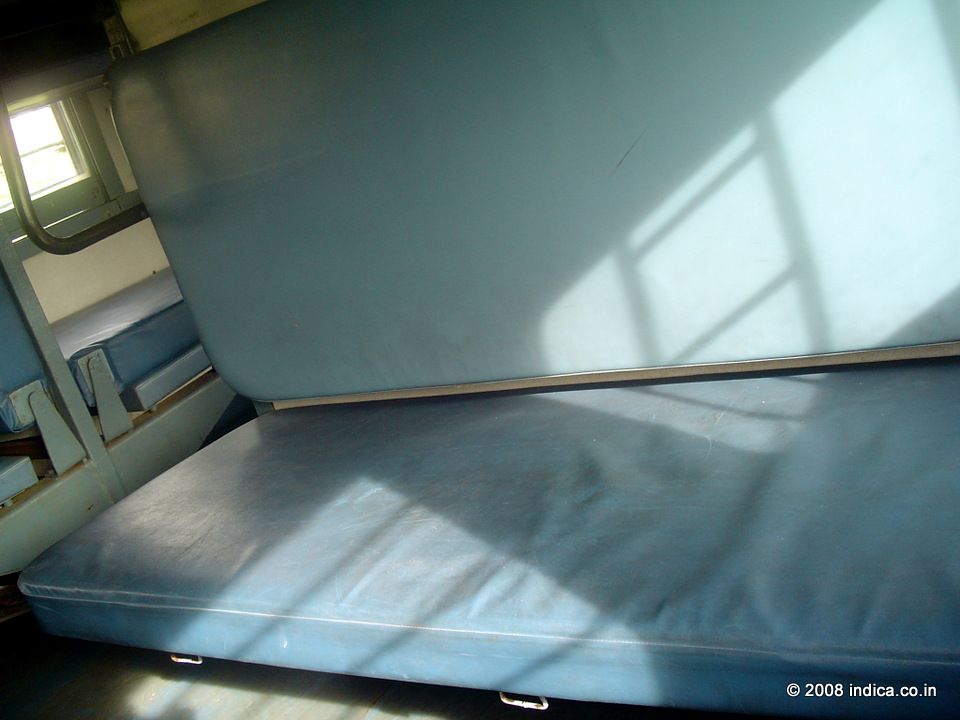 The sleeper class lower berth that duals as the sets during the daytime