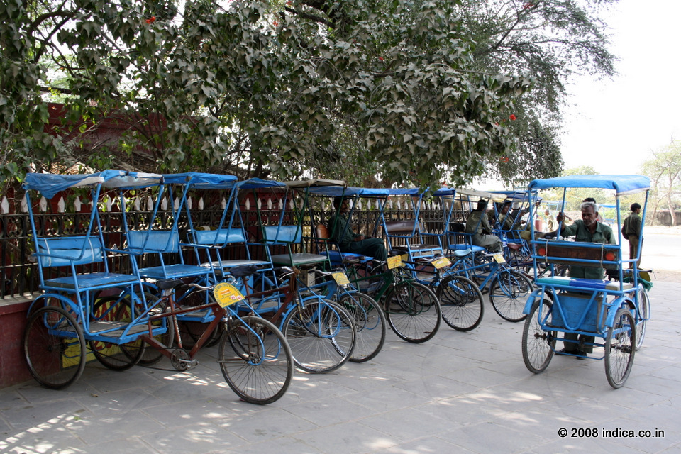cycle rickshaws stand at the gateway to the Keoladeo National Park.