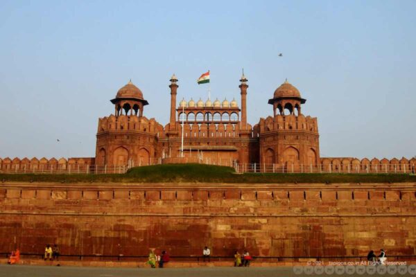 The facade of Red Fort with the India tri-colour flag flying atop.