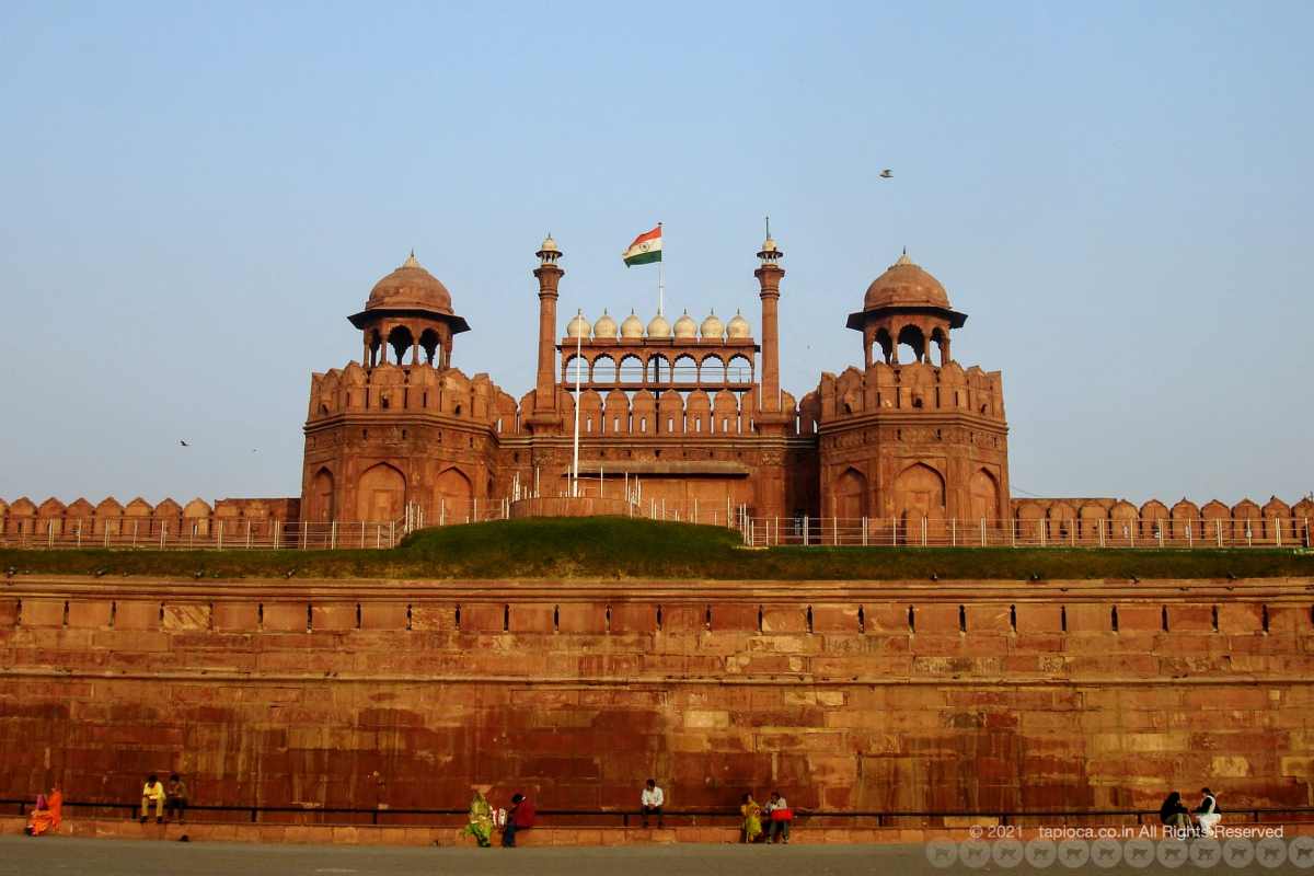 The facade of Red Fort with the India tri-colour flag flying atop. 