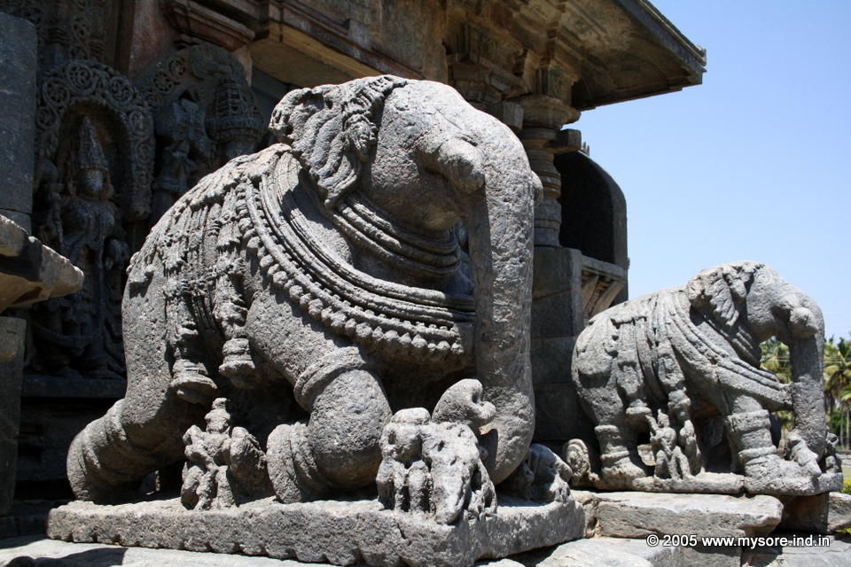 The richly carved elephant balustrades on the porch to the main shrine at Koravangala