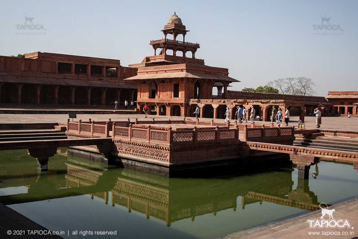 Anup Talao, a centerpiece in Fatehpur Sikri's attractions. In the backdrop is the 5 storied Panch Mahal