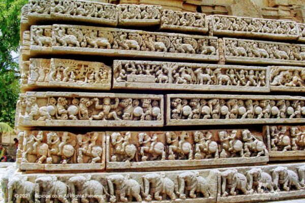The bottom band represents a elephants in various postures, all unique, above which is a series of horses and the next band represents lions. Above this is a sequence of mythical themes carved in sequence (like in a comics strips). The top two bands are of peacock and a mythological creature.