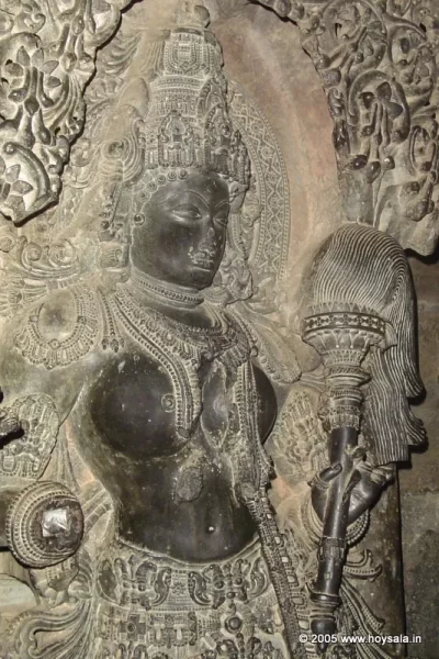 Woman Fly-whisk bearer at the doorway of Hoysaleswara Temple at Halebidu, Karnataka