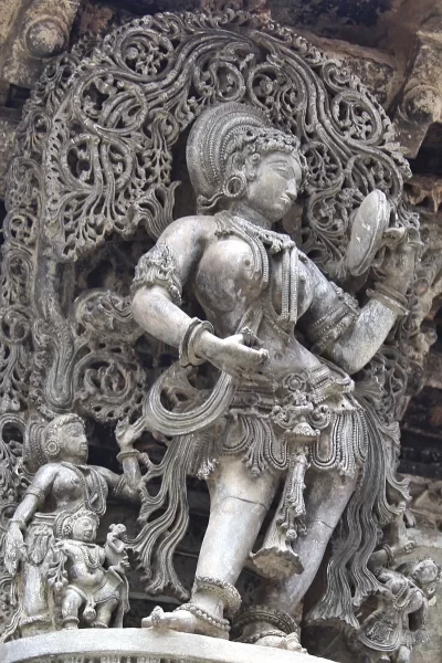 Lady with Mirror at Belur. This Masterpiece at Belur is often boasted to be the highest watermark of the Hoysala art.