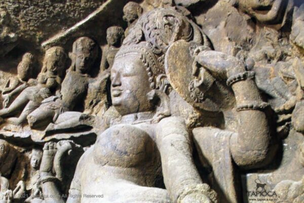 Ardhanarishvara at Elephanta . The image depicts the Parvathi's side. Note the elaborate crown decoration.
