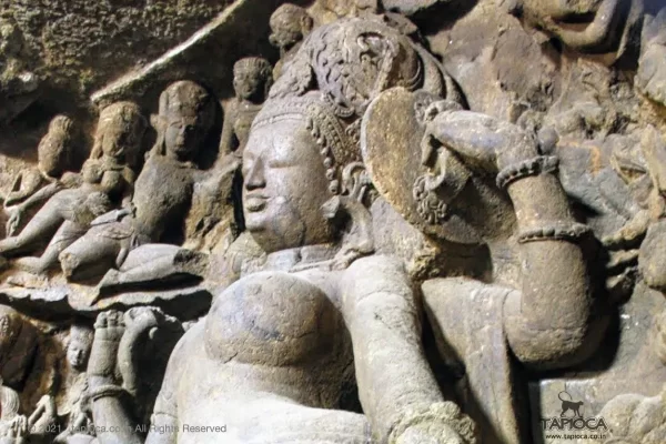 Ardhanarishvara at Elephanta . The image depicts the Parvathi's side. Note the elaborate crown decoration.