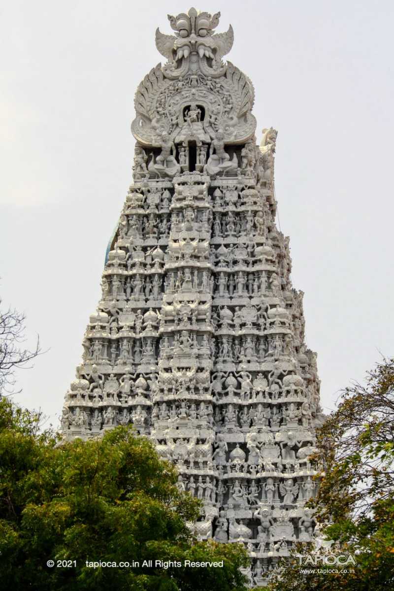 The nine-tier gopuram ( tower gate)  is 157 feet (47 meter) high, and decorated with terracotta stucco images of divine themes